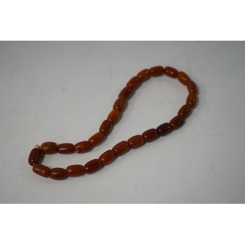 937 - A single strand amber bead necklace, 34cm, gross weight 20 grams. Condition - poor to fair