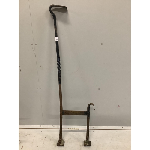 94 - A wrought iron boot scraper, height 122cm together with a hose reel stand. Condition - poor to fair... 