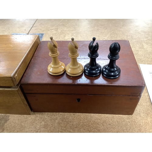 1447 - A chess set, possibly F H Ayres, in a mahogany box, and another larger weighted chess set, in box,  ... 