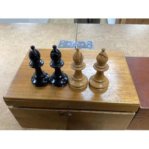 1447 - A chess set, possibly F H Ayres, in a mahogany box, and another larger weighted chess set, in box,  ... 