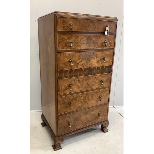 1002 - A Queen Anne Revival figured walnut and laburnam oyster veneered six drawer tall chest, width 70cm, ... 