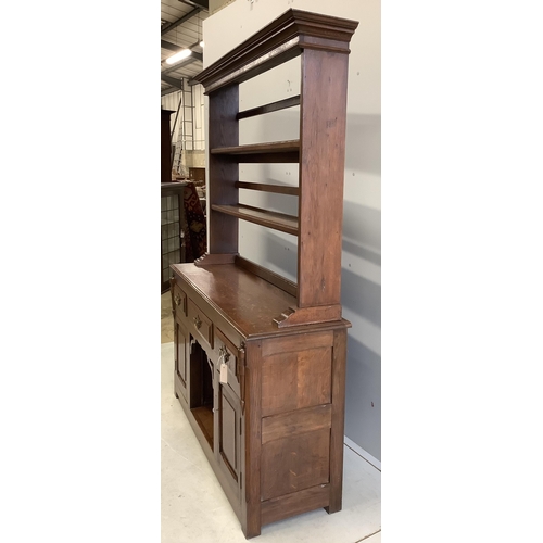 1003 - An 18th century style oak 'dog kennel' dresser, with boarded rack, width 138cm, depth 41cm, height 1... 