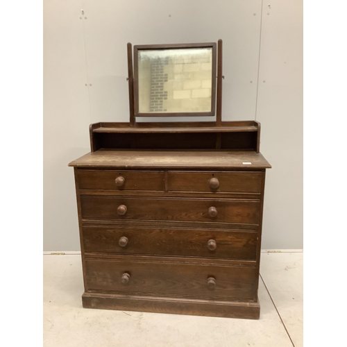 1004 - An early 20th century oak dressing chest, width 107cm, depth 49cm, height 155cm. Condition - poor Pr... 