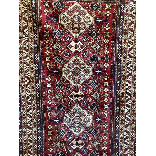 1008 - A Kazak red ground rug, 280 x 163cm. Condition - good