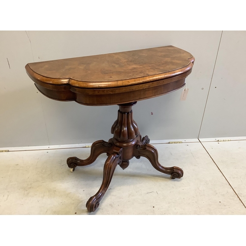 1010 - A Victoria figured walnut folding card table, width 91cm, depth 45cm, height 76cm. Condition - fair... 