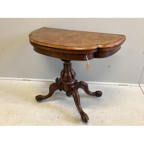 1010 - A Victoria figured walnut folding card table, width 91cm, depth 45cm, height 76cm. Condition - fair... 