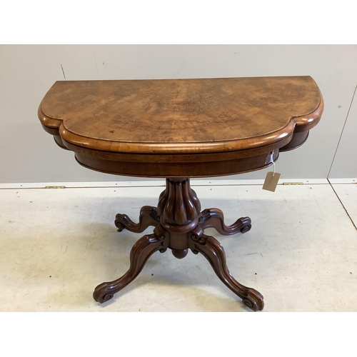 1010 - A Victoria figured walnut folding card table, width 91cm, depth 45cm, height 76cm. Condition - fair... 