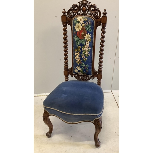 1014 - A pair of Victorian carved walnut side chairs with polychrome floral upholstered backs, width 46cm, ... 