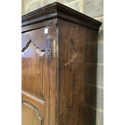 1016 - A mid 18th century carved oak cupboard, on associated stand, a.f., width 130cm, depth 55cm, height 1... 