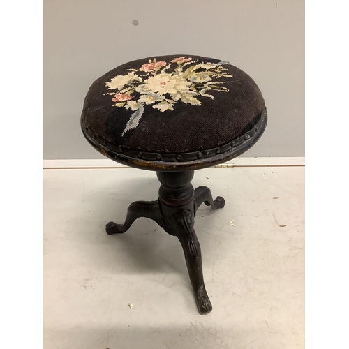 1032 - A Regency mahogany circular adjustable piano stool and a Victorian beech and cast iron piano stool. ... 