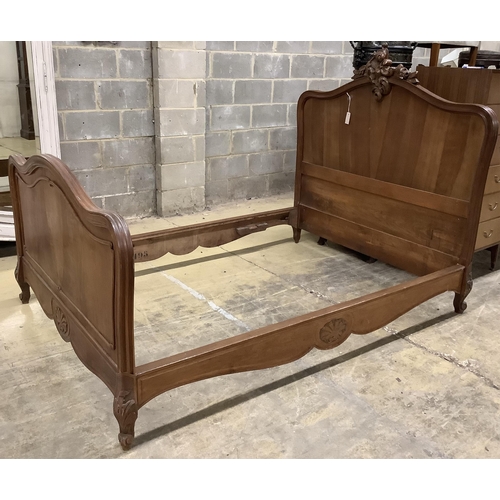 1037 - An early 20th century French walnut bedframe, width 140cm, length 199cm, height 142cm. Condition - f... 