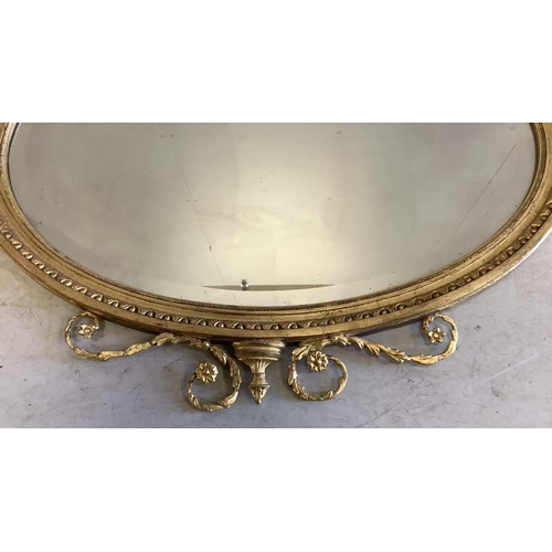 1041 - An Edwardian Sheraton Revivial oval giltwood and composition wall mirror, width 86cm, height 90cm. C... 