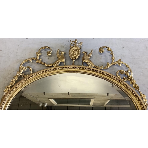 1041 - An Edwardian Sheraton Revivial oval giltwood and composition wall mirror, width 86cm, height 90cm. C... 