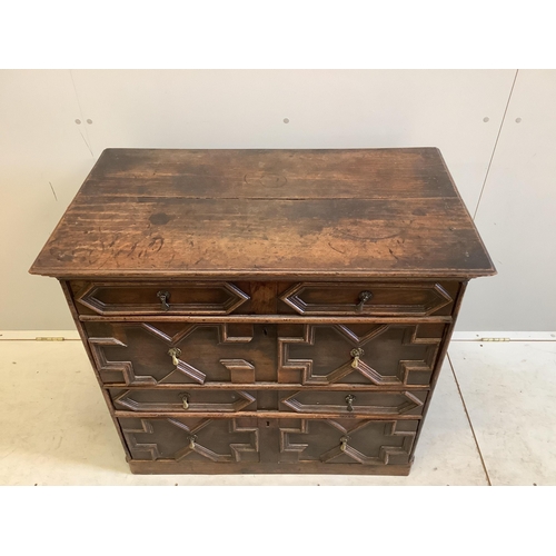 1055 - An 18th century geometric moulded oak chest, width 95cm, depth 54cm, height 86cm. Condition - fair... 