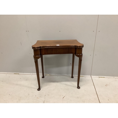 1064 - A George II style mahogany folding card table, width 75cm, depth 38cm, height 76cm. Condition - fair... 