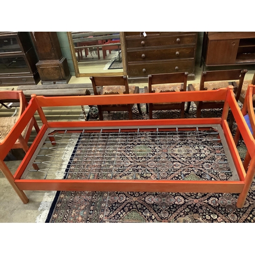 1065 - An early Habitat Magistretti style red stained beech settee, width 198cm, depth 84cm, height 69cm an... 