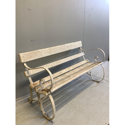 1067 - A white painted slatted wood garden bench with wrought iron ends, width 137cm, depth 63cm, height 78... 