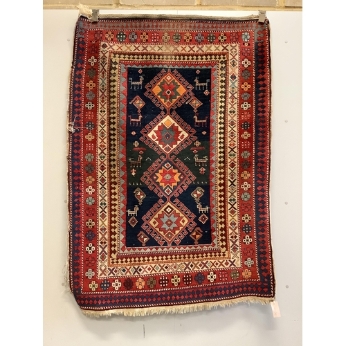 1071 - An antique Kazak blue ground rug, 150 x 109cm. Condition - fair