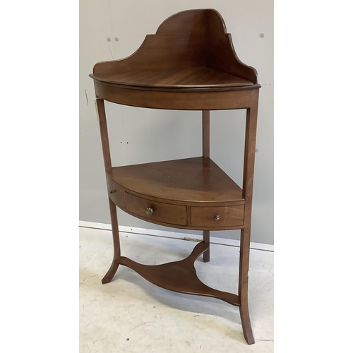 1073 - A George III mahogany two tier bow front corner washstand, width 57cm, depth 37cm, height 99cm. Cond... 