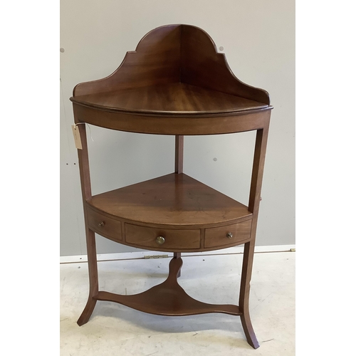 1073 - A George III mahogany two tier bow front corner washstand, width 57cm, depth 37cm, height 99cm. Cond... 