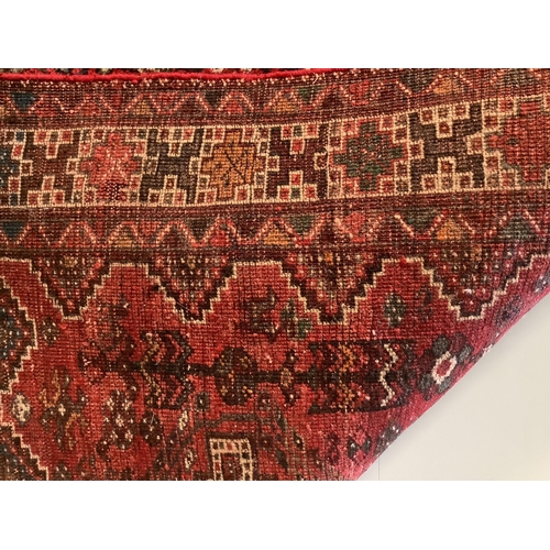 1078 - A Shiraz red ground rug, 200 x 157cm. Condition - fair