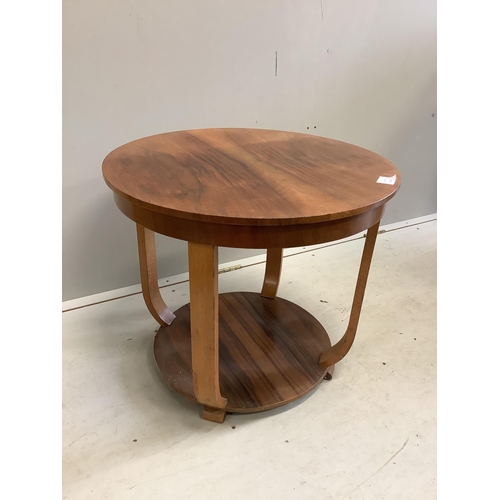 1091 - An Art Deco walnut circular two tier occasional table, diameter 60cm, height 52cm. Condition - fair... 