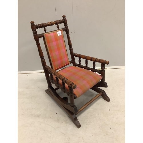 1096 - A late 19th century American turned beech childs rocking chair, width 39cm, depth 49cm, height 66cm... 