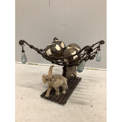 1100 - A Contemporary composition elephant and basket centrepiece, width 43cm, height 37cm. Condition - fai... 