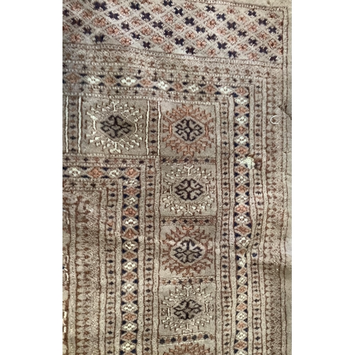 1124 - A Bokhara peach ground carpet, 320 x 215cm. Condition - poor to fair