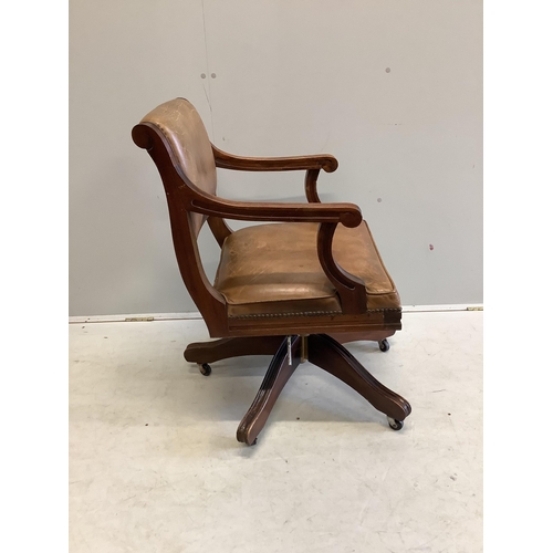 1127 - A reproduction mahogany and tan leather swivel desk chair, width 56cm, depth 52cm, height 84cm. Cond... 