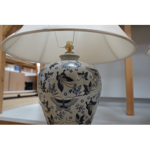 1311 - A pair of Japanese ceramic table lamps, decorated with butterflies, with shades.  Condition - good, ... 