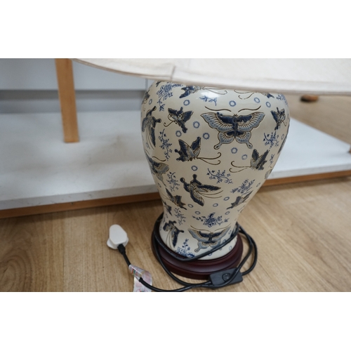 1311 - A pair of Japanese ceramic table lamps, decorated with butterflies, with shades.  Condition - good, ... 