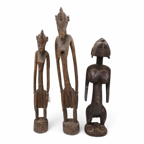 1313 - Three African tribal figural carvings including one Dogon maternity figure, largest 82cm. Condition ... 