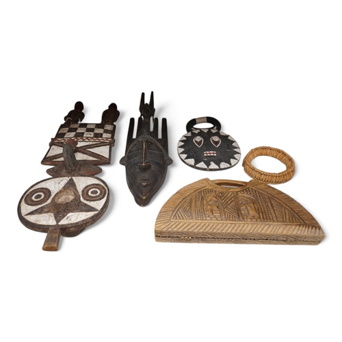 1315 - Three African tribal masks and a carved folding tray, largest 92cm. Condition - fair to good