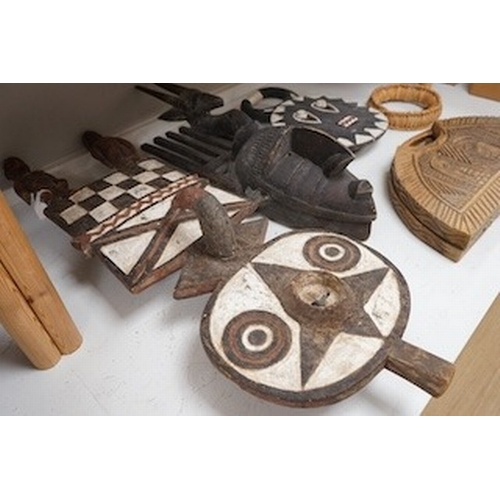 1315 - Three African tribal masks and a carved folding tray, largest 92cm. Condition - fair to good