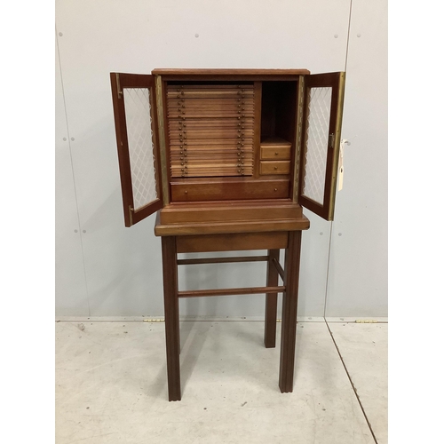 1460 - A modern mahogany coin collector's cabinet on stand