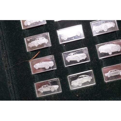 1834 - A cased set of one hundred 925 ingots, each depicting a different car model, each 27mm and weighing ... 