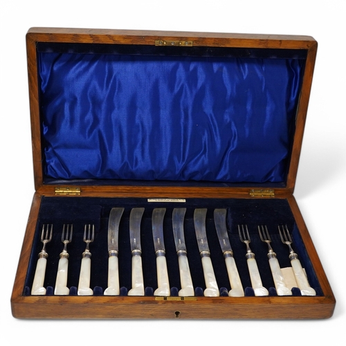 1835 - A cased set of six pairs of late Victorian mother of pearl pistol handled silver dessert eaters, by ... 