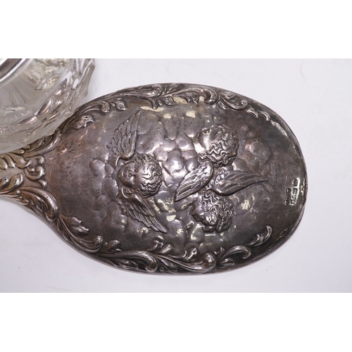 1840 - An Edwardian silver mounted hand mirror with Reynold's Angels decoration, William Neale Ltd, Chester... 