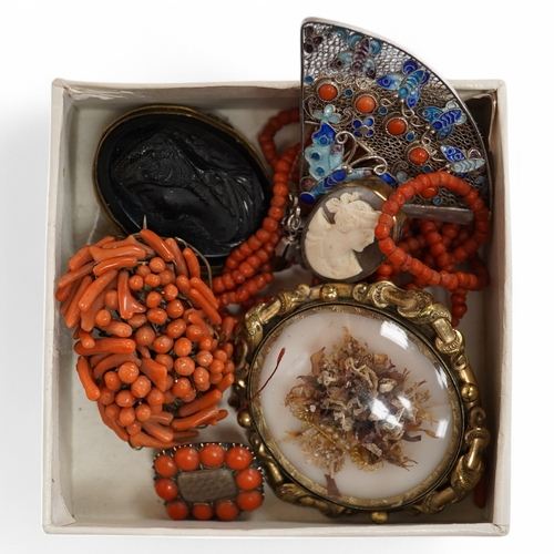 1926 - A Victorian yellow metal and coral bead set mourning brooch, with plaited hair beneath a glazed pane... 