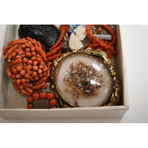 1926 - A Victorian yellow metal and coral bead set mourning brooch, with plaited hair beneath a glazed pane... 