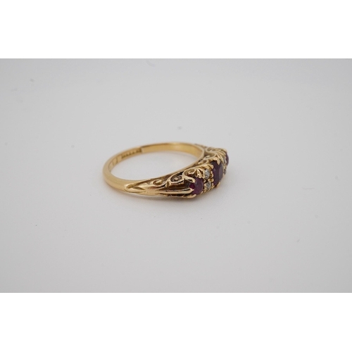 1932 - An Edwardian 18ct gold, three stone ruby and four stone diamond set half hoop ring, size K, gross we... 