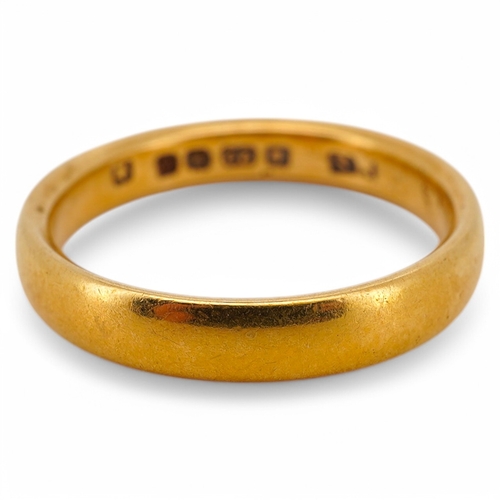 1940 - A George V 22ct gold wedding band, hallmarked for Birmingham, 1925, size N, 4.8 grams. Condition - f... 