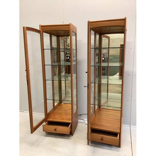 1 - A pair of Parker Knoll teak display cabinets, width 46cm, depth 38cm, height 165cm. Condition - good... 