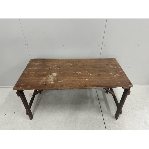 150 - A folding pine trestle table, width 136cm, depth 67cm, height 74cm. Condition - poor