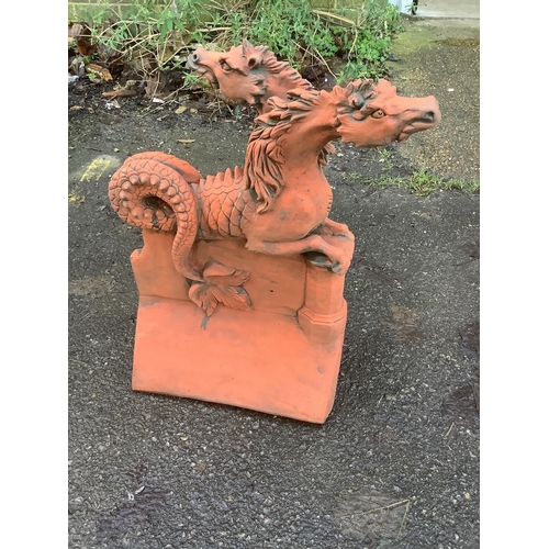 184 - Three terracotta ridge tiles. Condition - largest height 52cm. Condition - fair to good