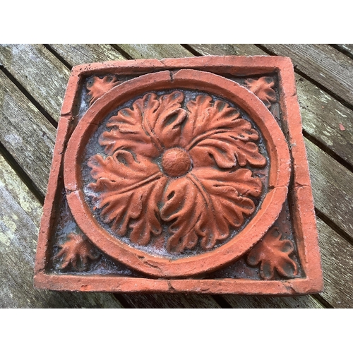 186 - Six terracotta decorative tiles, largest width 21cm. Condition - fair