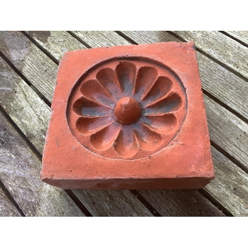 186 - Six terracotta decorative tiles, largest width 21cm. Condition - fair