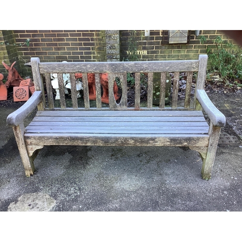 188 - A teak garden bench and a teak circular table, table diameter 148cm, height 70cm. Condition - fair... 