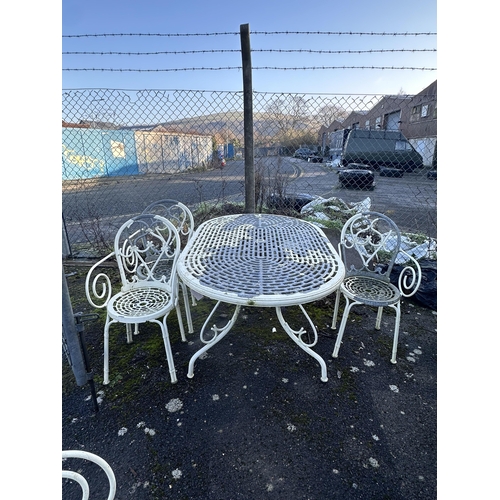 195 - An aluminium garden table, width 150cm, depth 96cm, height 71cm, three chairs and a bench. Condition... 